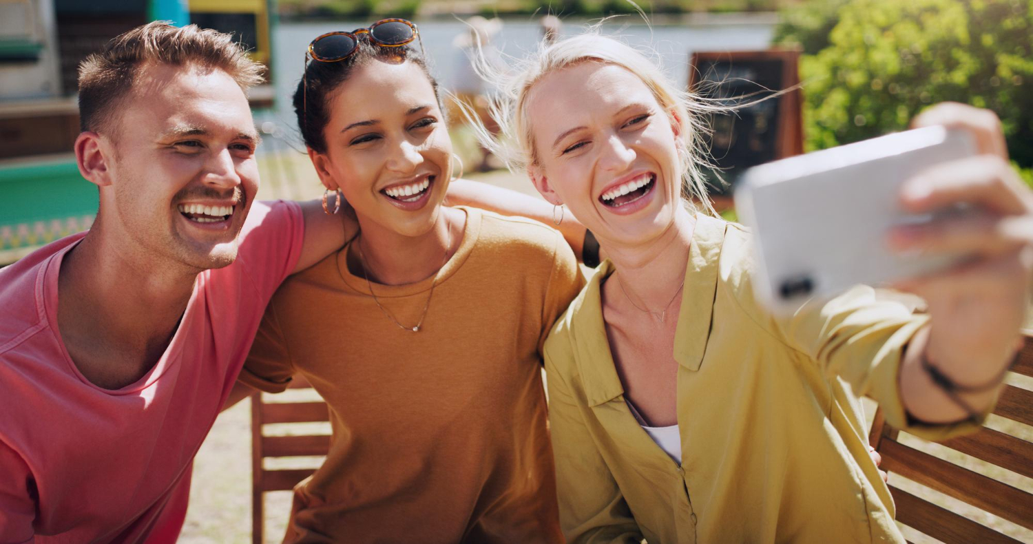 girl takes selfie with friends
